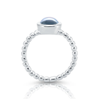 Sterlingsilberring mit rundem himmelblauer Topas-Cabochon RI-10117A